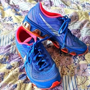 Hot pink and blue Nike Tailwind 6 size 8